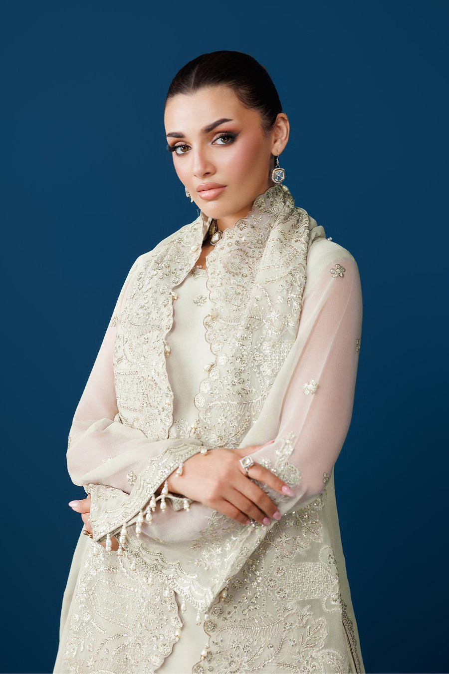 Woman wearing the chiffon dress with embroidered dupatta draped over shoulders