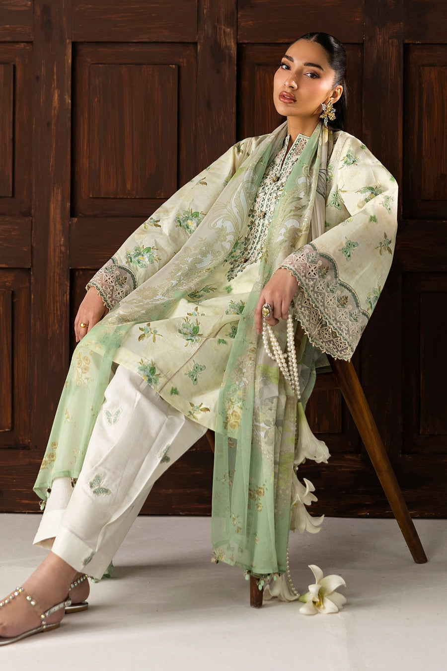 Elegant close-up highlighting embroidered neckline and sheer dupatta draped over shoulder