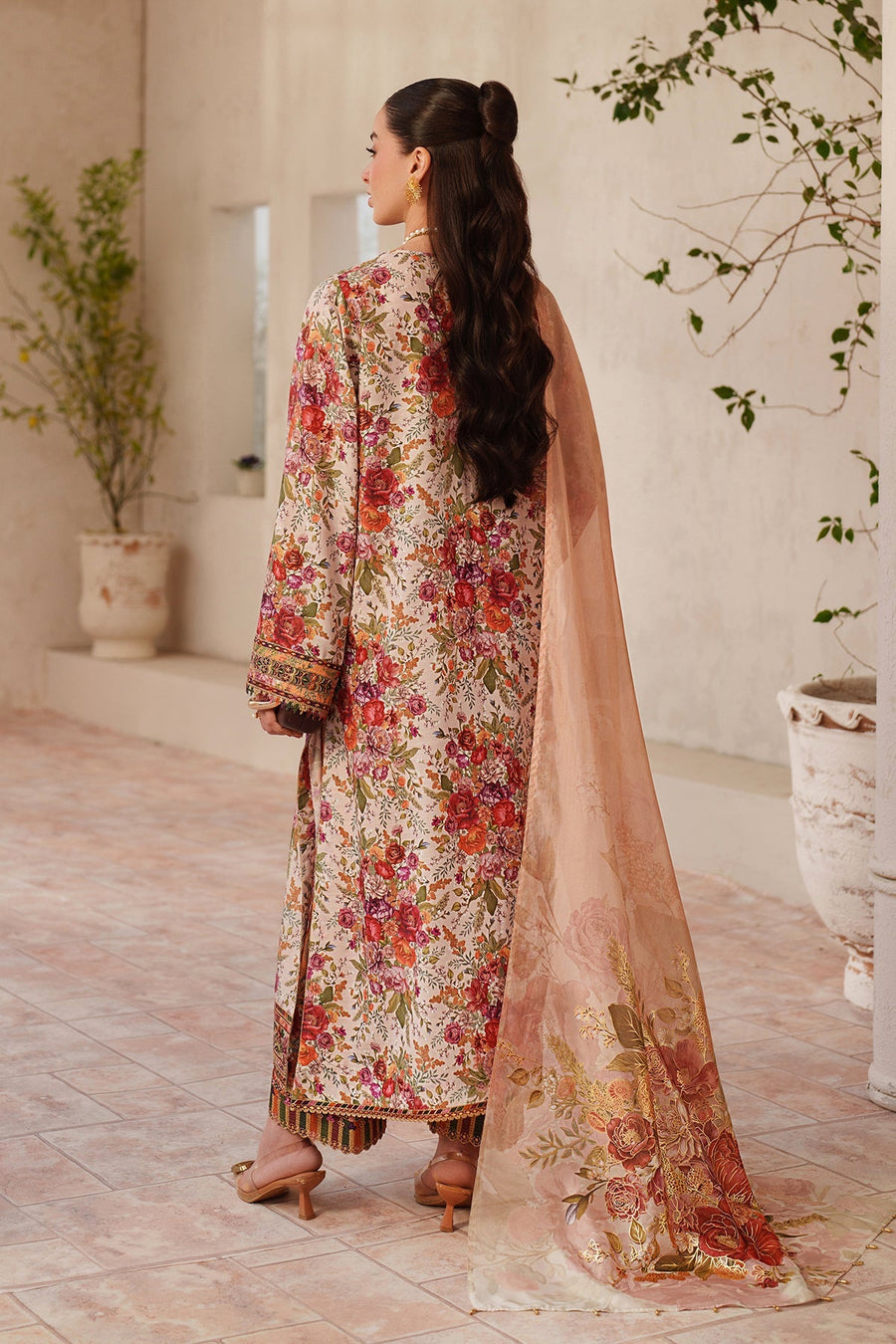 Rear view of the floral embroidered lawn suit showing digital floral prints on the back and peach dupatta