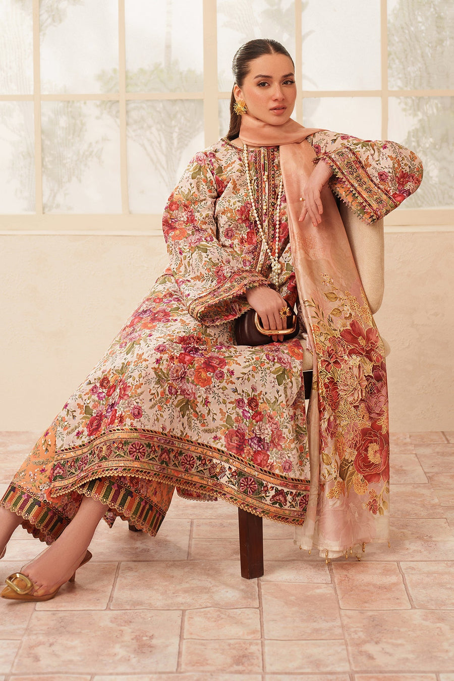 Model showing full front floral embroidery with embroidered sleeves and peach dupatta draped over shoulders