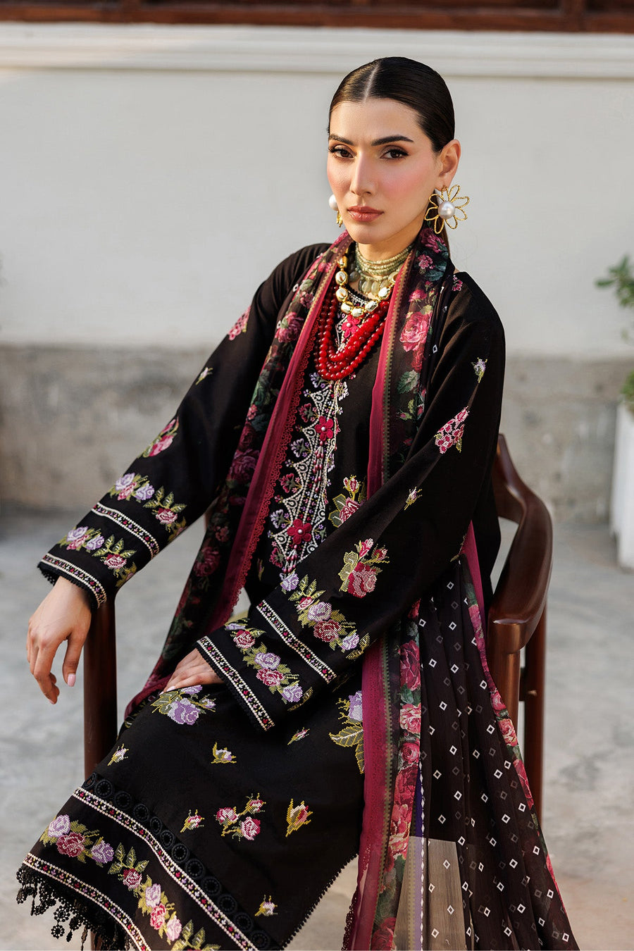 Full seated view showing embroidery, dupatta print, and stylish coordination with accessories