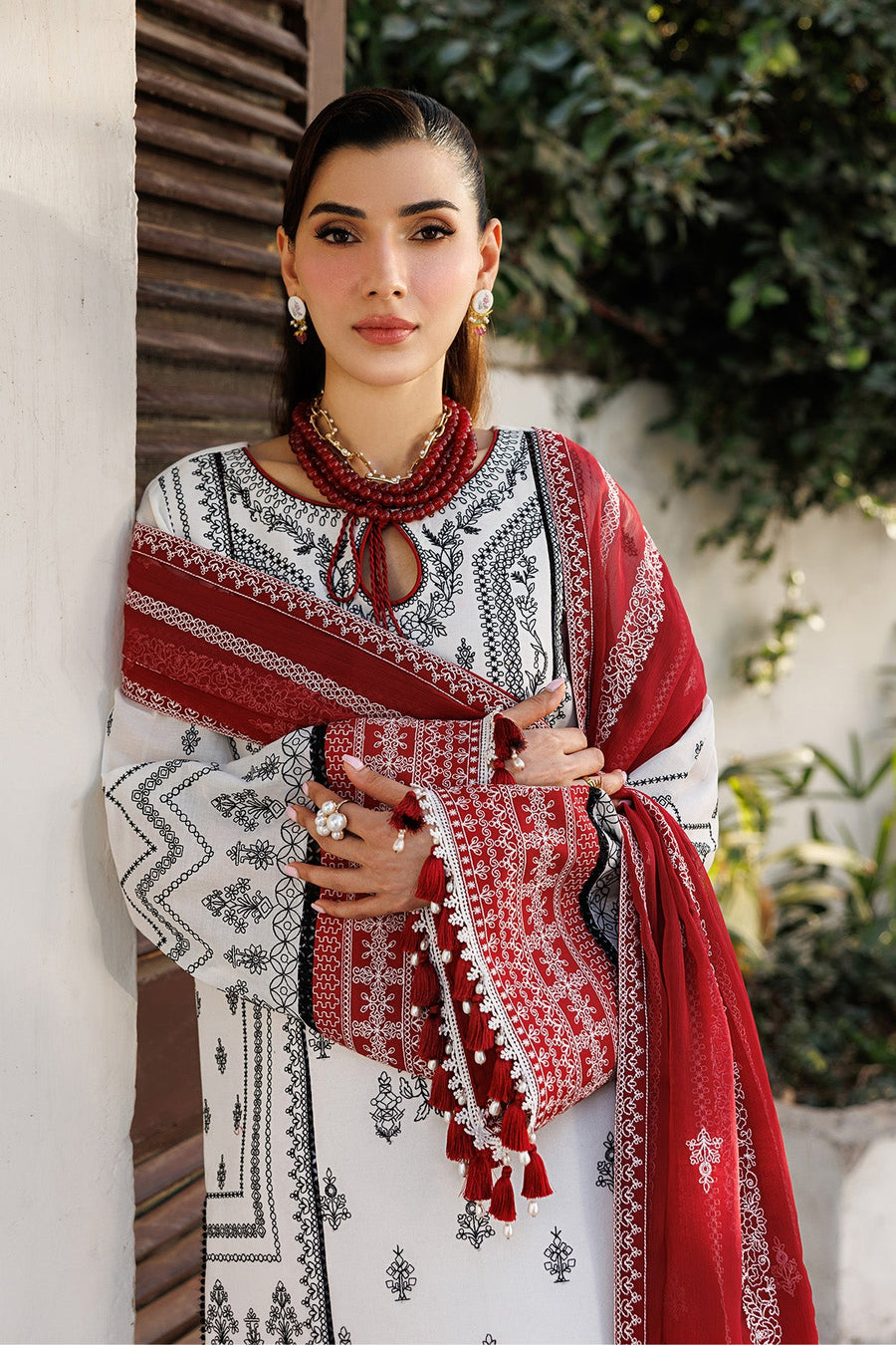 Full outfit view featuring embroidered lawn suit, white cotton trousers with lace, and red dupatta