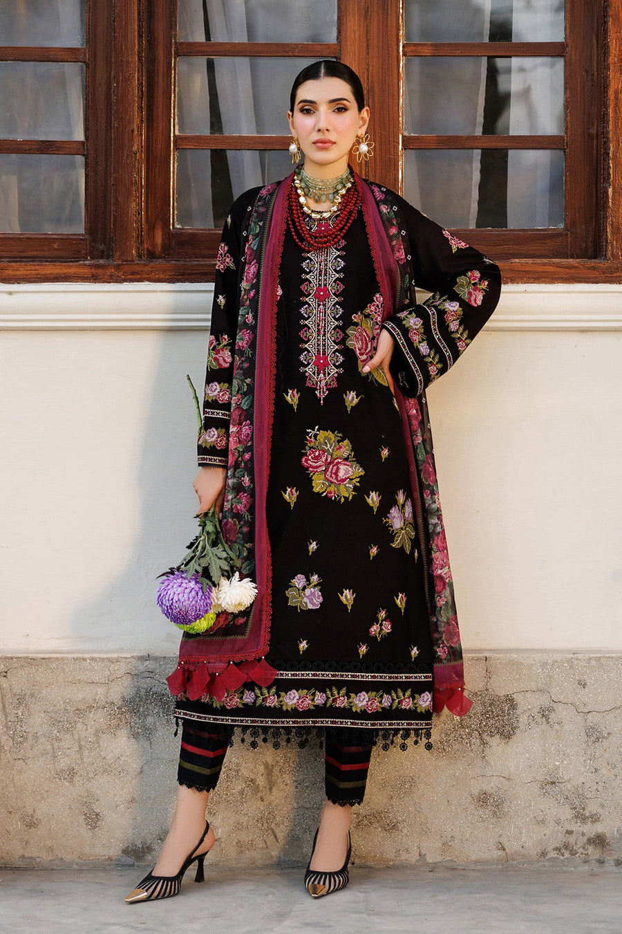 Side view showcasing embroidered sleeve detail and floral embroidery on front with matching accessories
