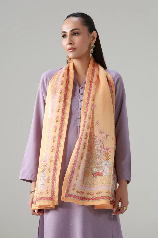 Woman wearing a luxurious peach silk dupatta with intricate floral embroidery over a lavender traditional outfit