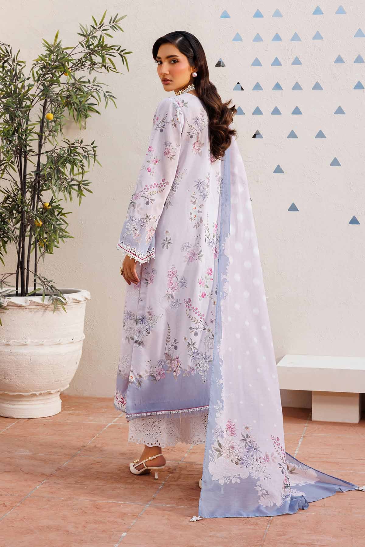 Rear view of woman showcasing delicate floral and embroidery details on the lavender lawn suit and flowing dupatta.