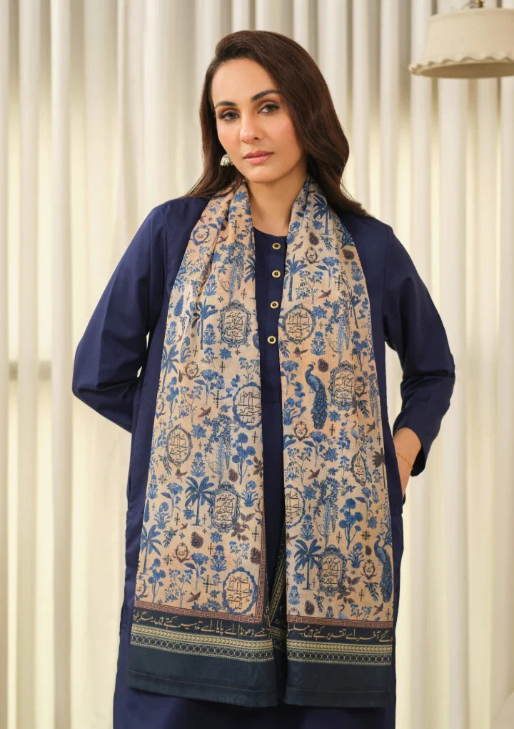 Woman wearing an embroidered Swiss lawn printed scarf with blue Urdu calligraphy and nature motifs over a navy blue outfit