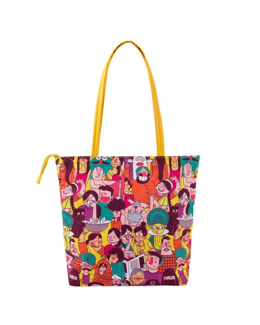 Back view of colorful illustrated tote bag featuring playful character artwork and yellow straps