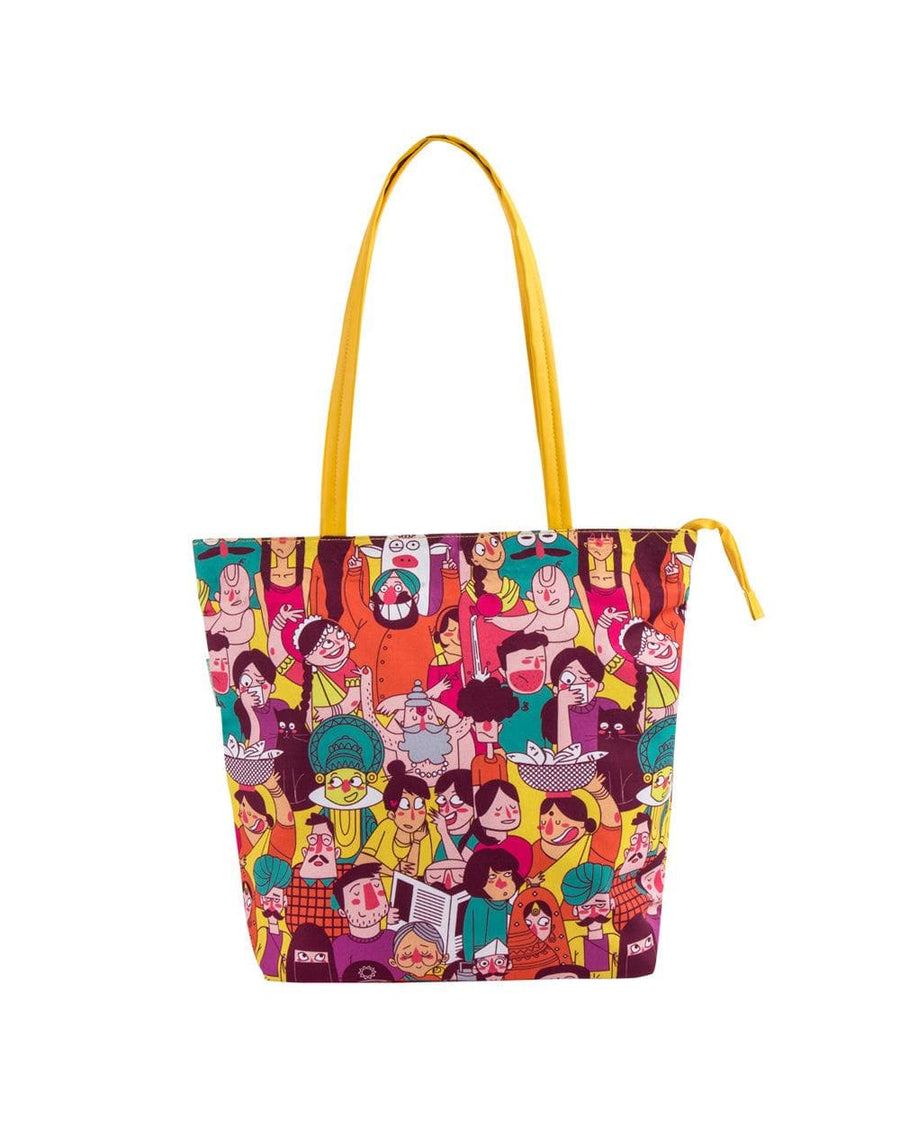 Front view of colorful illustrated tote bag with yellow handles and zip closure