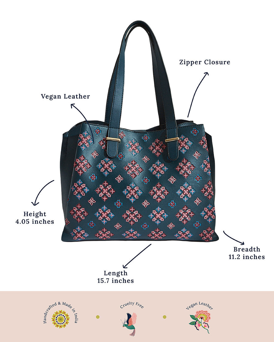 Annotated image showing the tote bag's measurements, vegan leather material, and zipper closure