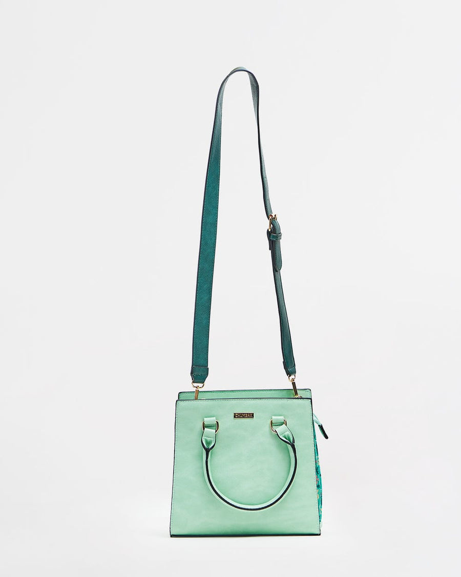 Mint floral structured handbag front view with dark green adjustable shoulder strap attached