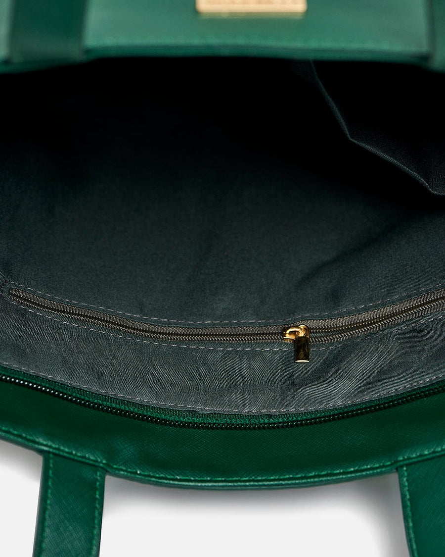 Close-up of interior zippered pocket inside the Palm Springs tote bag lined with dark fabric