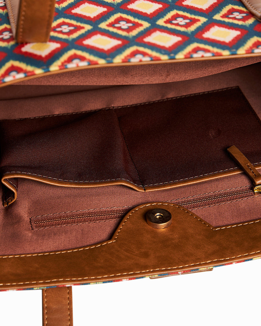 Interior view of Teal by Chumbak tote bag displaying fabric lining, multiple pockets, and zipper compartment