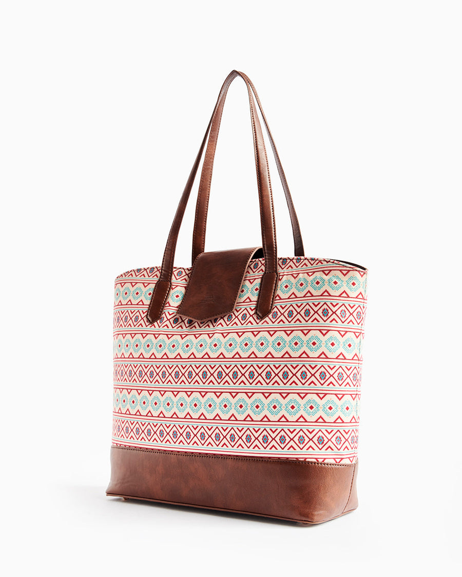 Side angle of Aztec patterned tote bag showing structure and leather accents