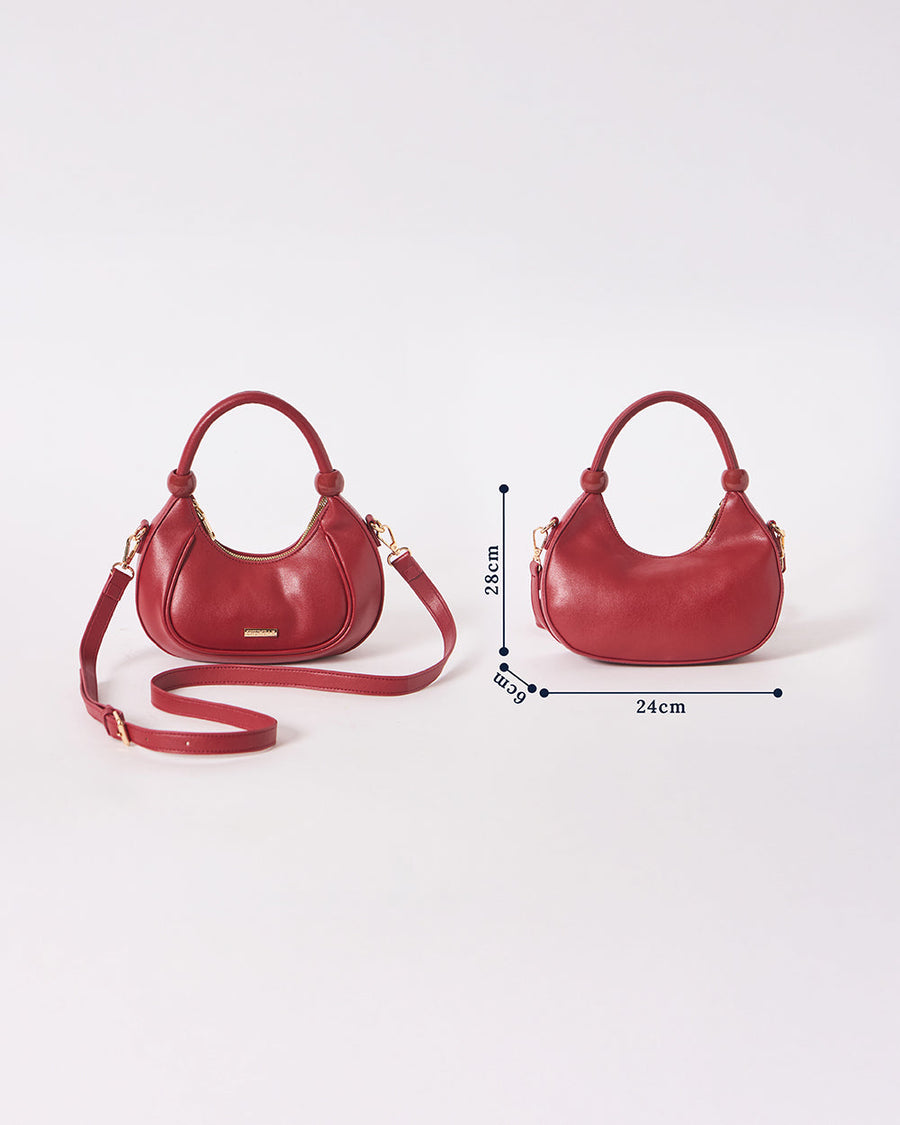 Front and back measurements of the maroon vegan leather crescent handbag displaying dimensions as 28 cm height, 24 cm width, and 6 cm depth.