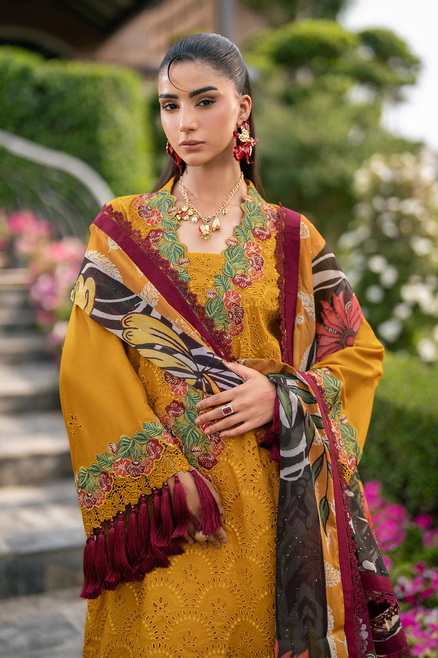 Close-up portrait of woman wearing embroidered lawn shirt highlighting floral neck embroidery and dupatta