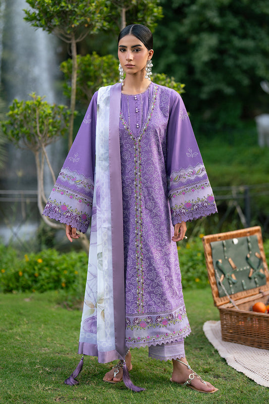 Model wearing a purple embroidered lawn suit with printed chiffon dupatta outdoors