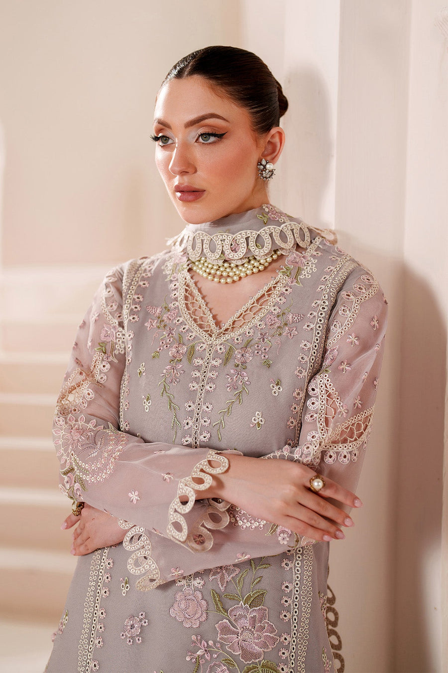 Close-up of front embroidery and lace detailing on lavender chiffon suit
