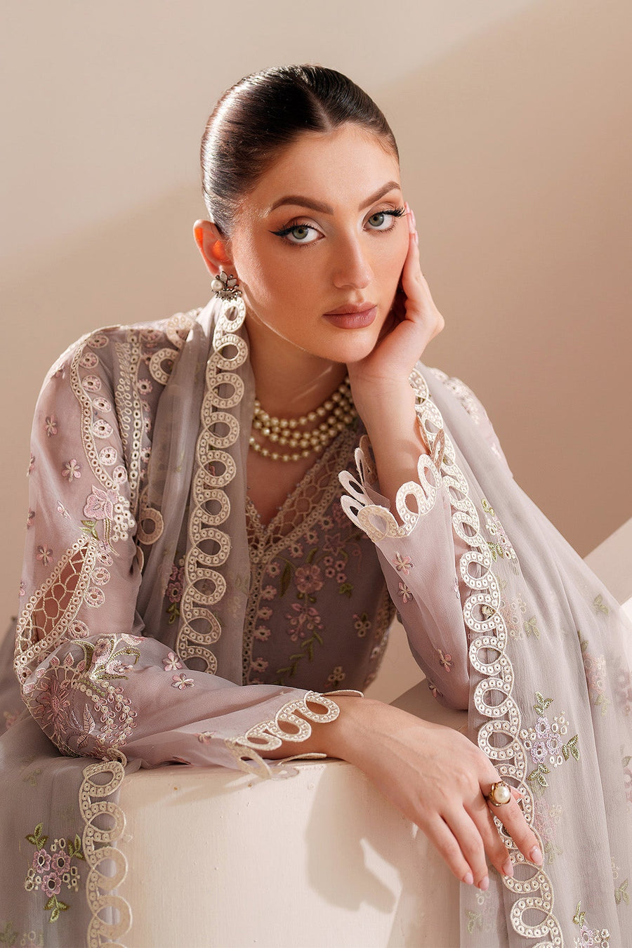 Full view of embroidered lavender chiffon formal suit with matching dupatta draped over shoulder