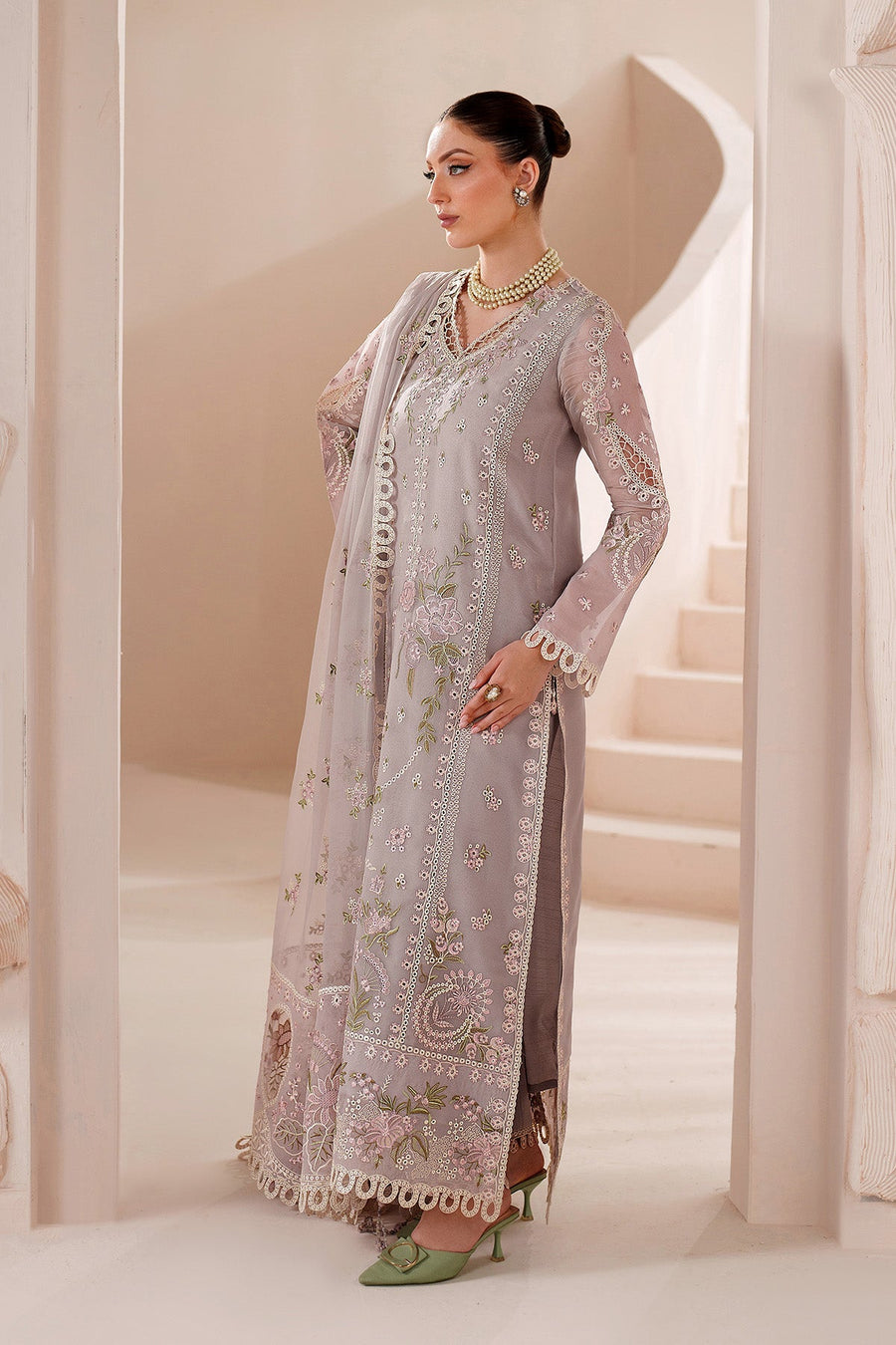 Side view highlighting embroidery pattern and lace borders on sleeves and dupatta