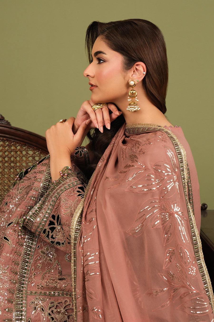 Model wearing the full embroidered suit showcasing elegant accessories