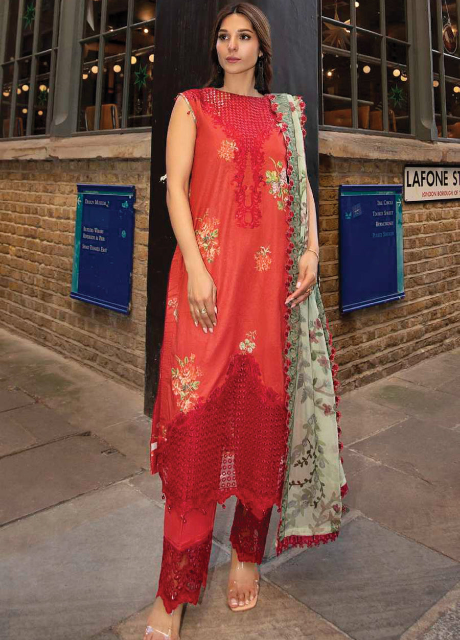 Front view of a woman wearing a red floral embroidered sleeveless lawn suit with matching embroidered trousers and a green floral chiffon dupatta.