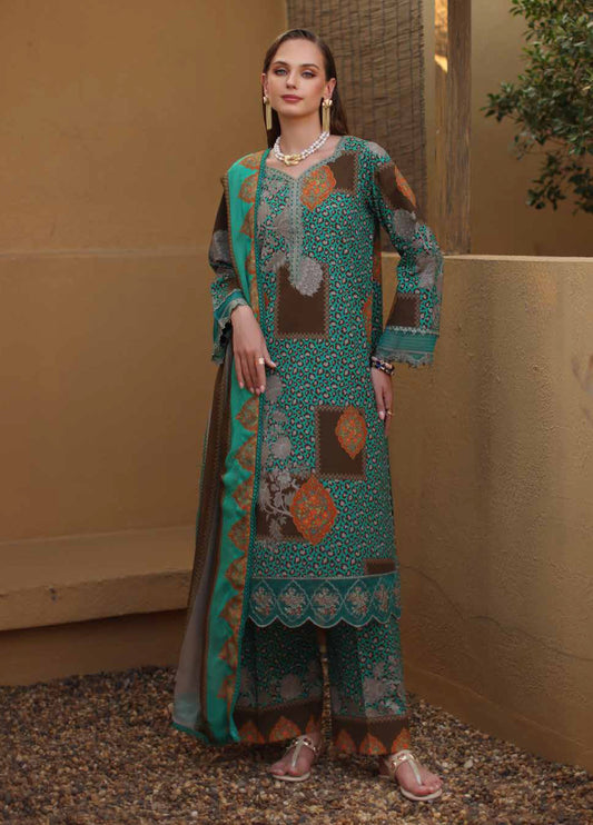 Woman standing wearing a teal, brown, and orange 3-piece embroidered lawn suit with patchwork and leopard print designs, paired with a matching dupatta and golden sandals