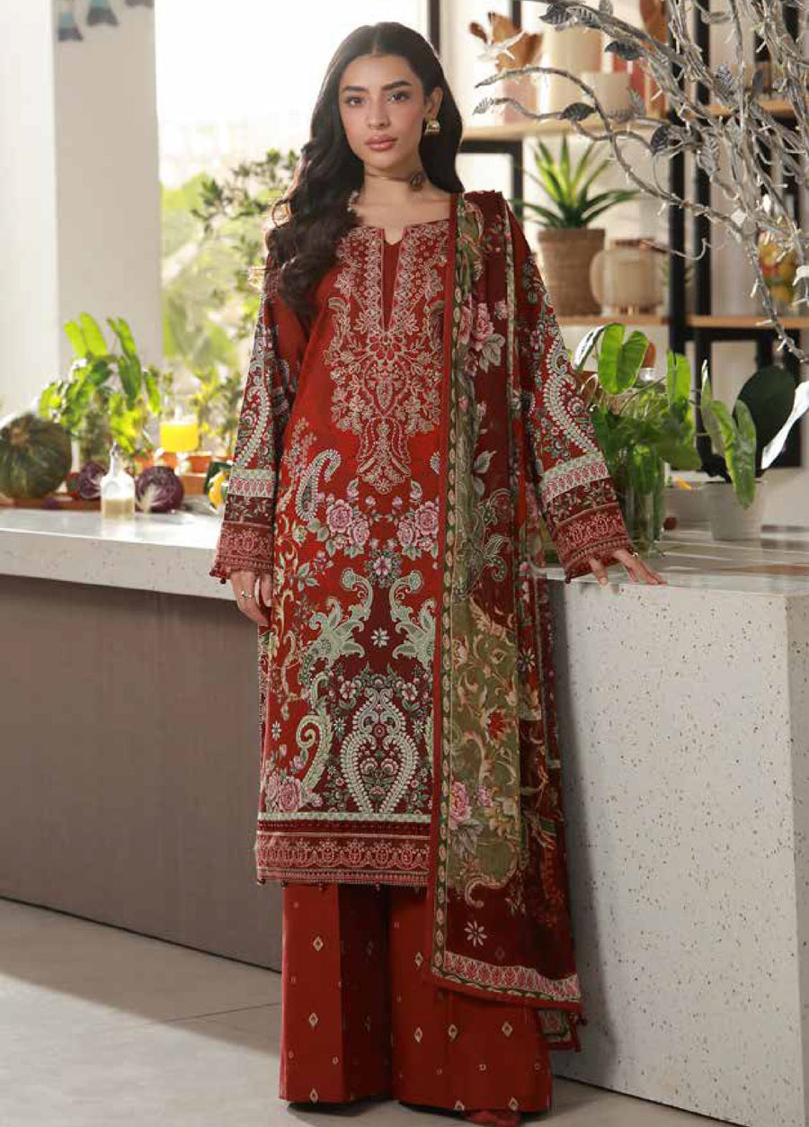 Front view of a woman wearing an elegant maroon embroidered lawn suit with detailed floral embroidery and matching printed dupatta