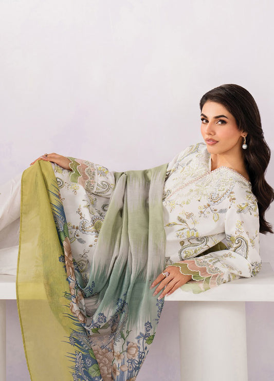 Woman reclining while elegantly displaying the floral printed chiffon dupatta, showcasing detailed embroidery on the lawn shirt sleeves and neckline.