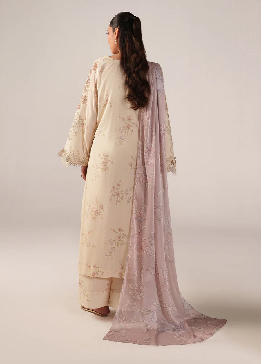 Rear view of woman wearing cream lawn suit with subtle floral prints and a long pink dupatta featuring detailed floral embroidery