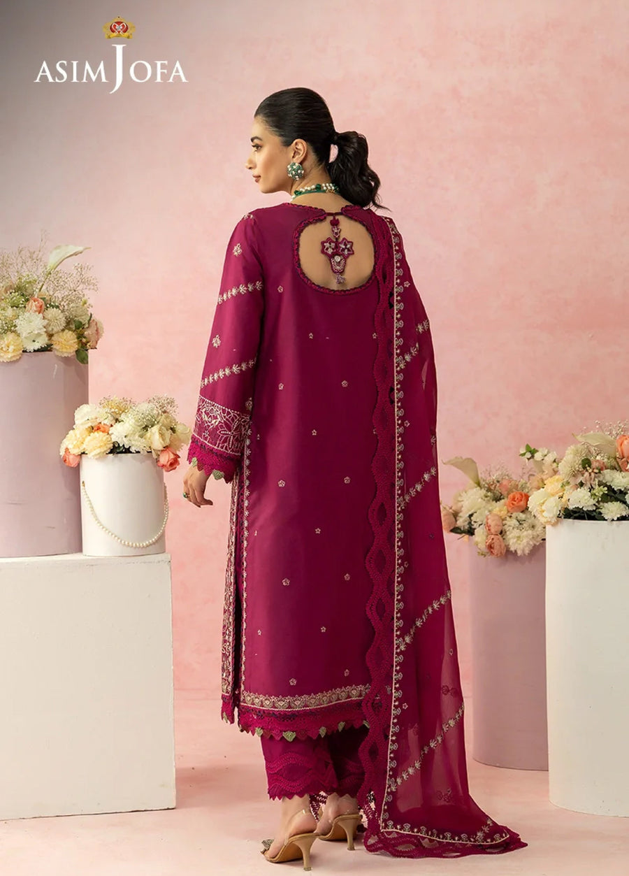 Back view of magenta luxury lawn suit featuring embroidered sleeve cuffs, back keyhole neckline with tassels, and matching embroidered chiffon dupatta.