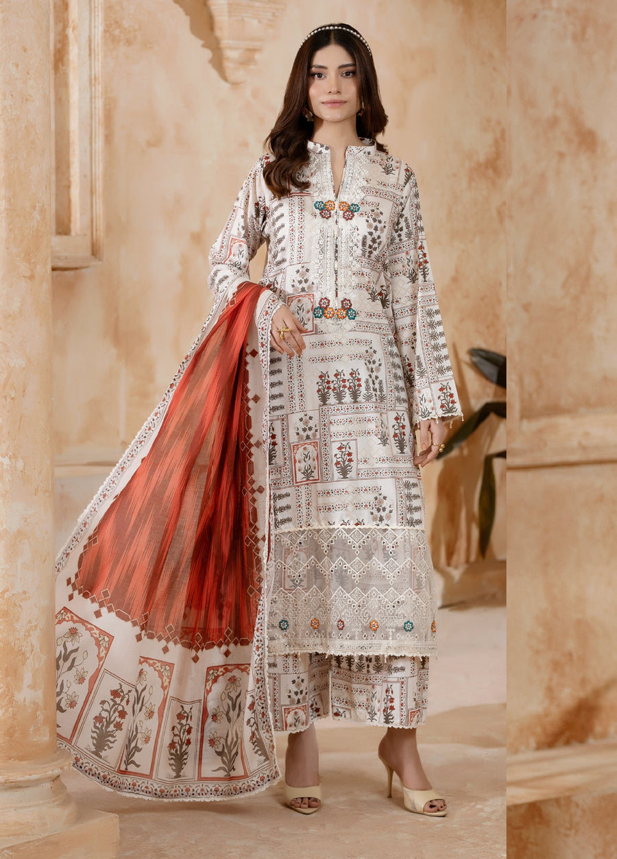 Side view of woman holding vibrant rust-orange printed dupatta paired with embroidered shirt and floral trousers