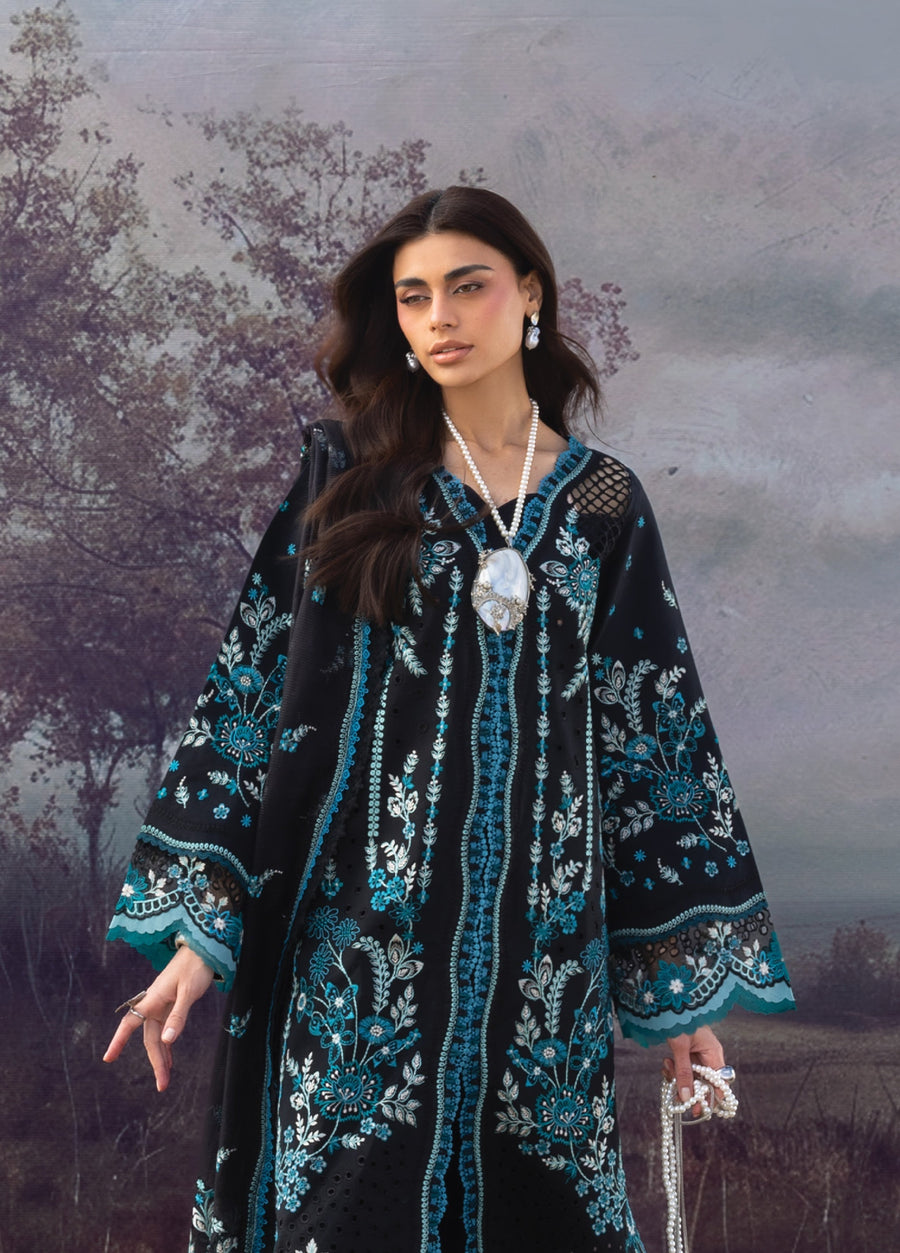 Portrait of woman in embroidered black lawn suit showcasing delicate net and floral embroidery details