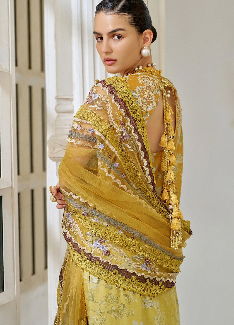 Close-up back view showcasing detailed embroidery and the tassel tie design on the sheer mustard dupatta draped over the shoulder, emphasizing lace and floral embroidery.