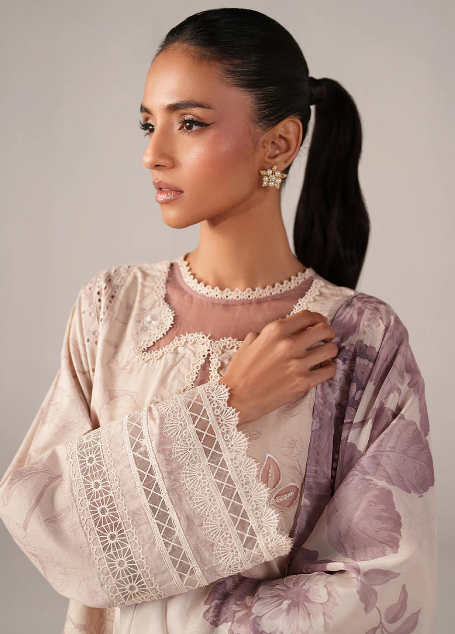 Portrait of the woman wearing the suit highlighting the embroidered neckline, delicate lace cuffs, and floral earrings