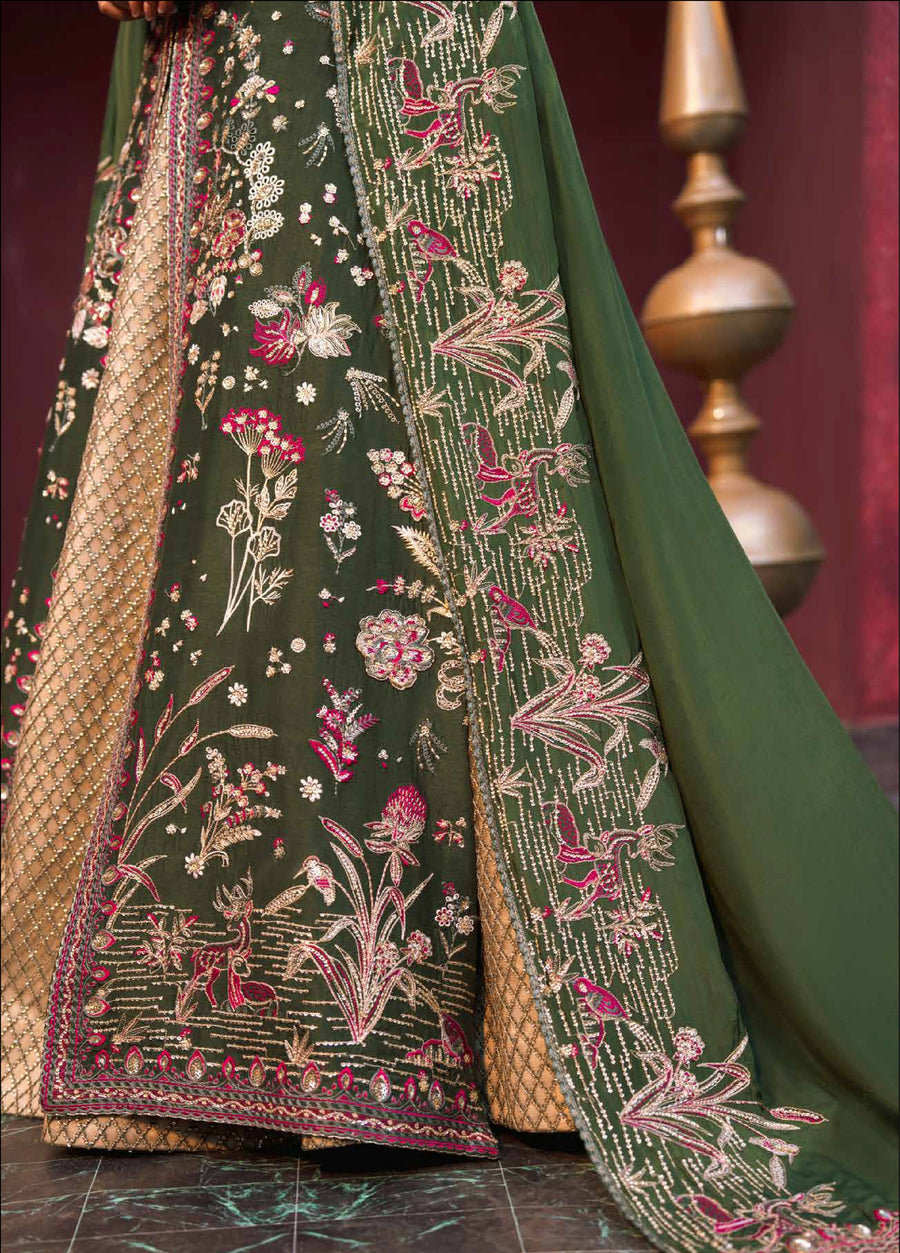 Close-up of the embroidered border of the dark green dupatta showing intricate stitching, floral motifs, and bead embellishments overlaid on the golden lehenga fabric.