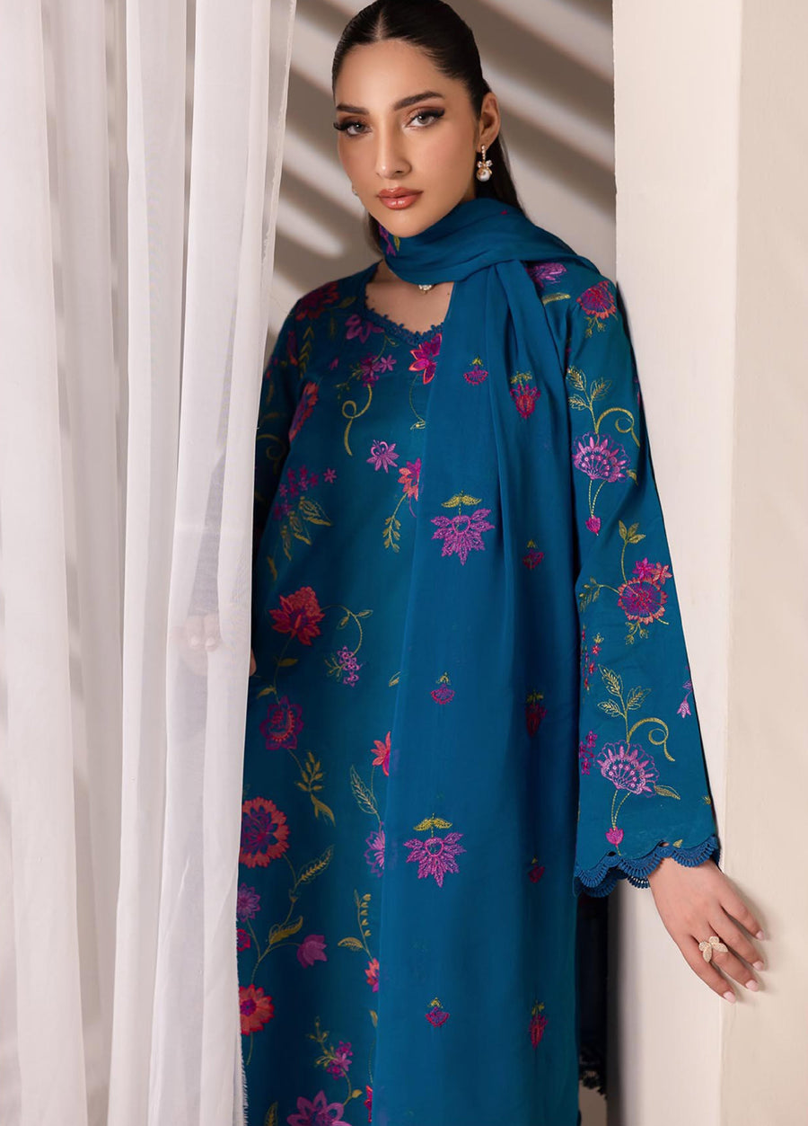 Detailed view of the embroidered lawn fabric and neckline, showing the delicate floral patterns and scalloped embroidery edges