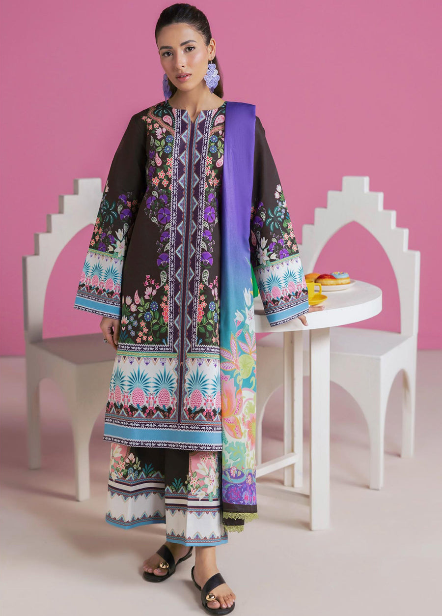 Front view of woman wearing elegant floral printed lawn suit in dark base with purple, pink, and aqua flower motifs paired with blue gradient dupatta