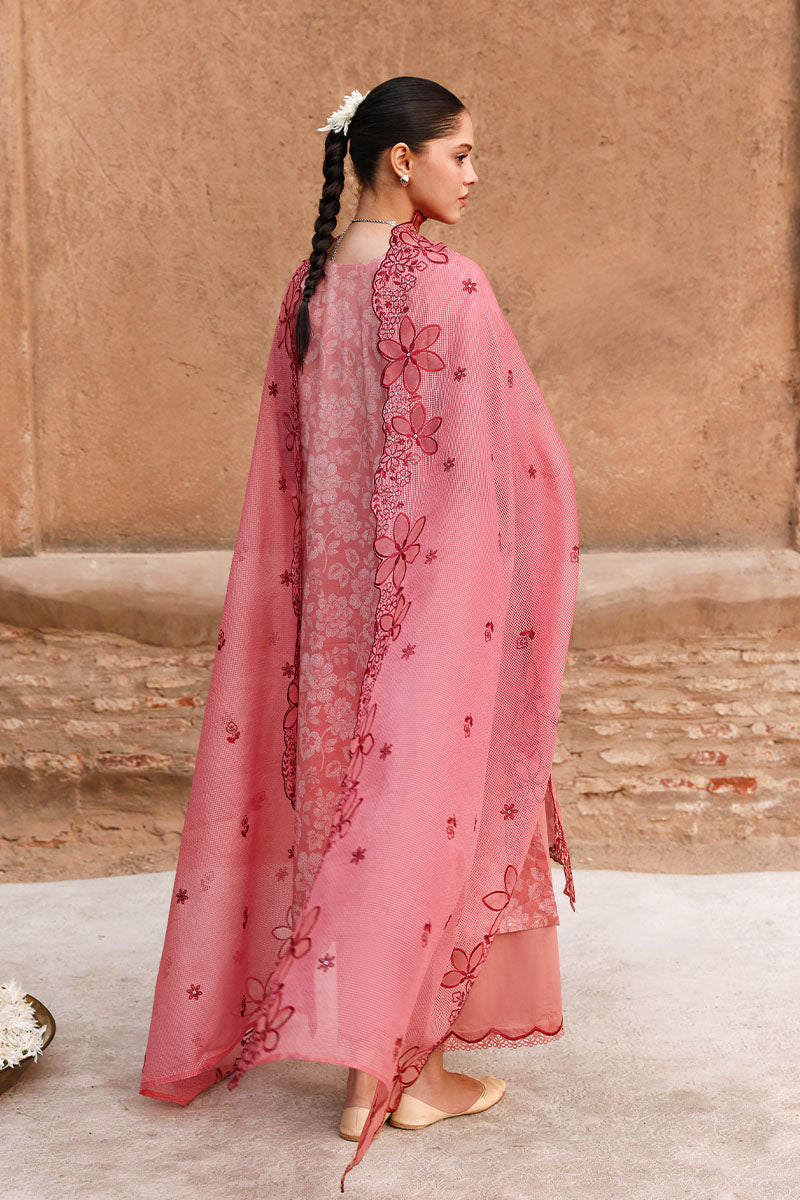 Back view of woman with embroidered dupatta flowing, showcasing detailed floral embroidery along edges and modest style.