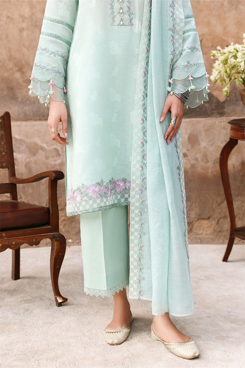Close-up showing embroidered sleeve cuffs with scalloped lace and floral bead embellishments