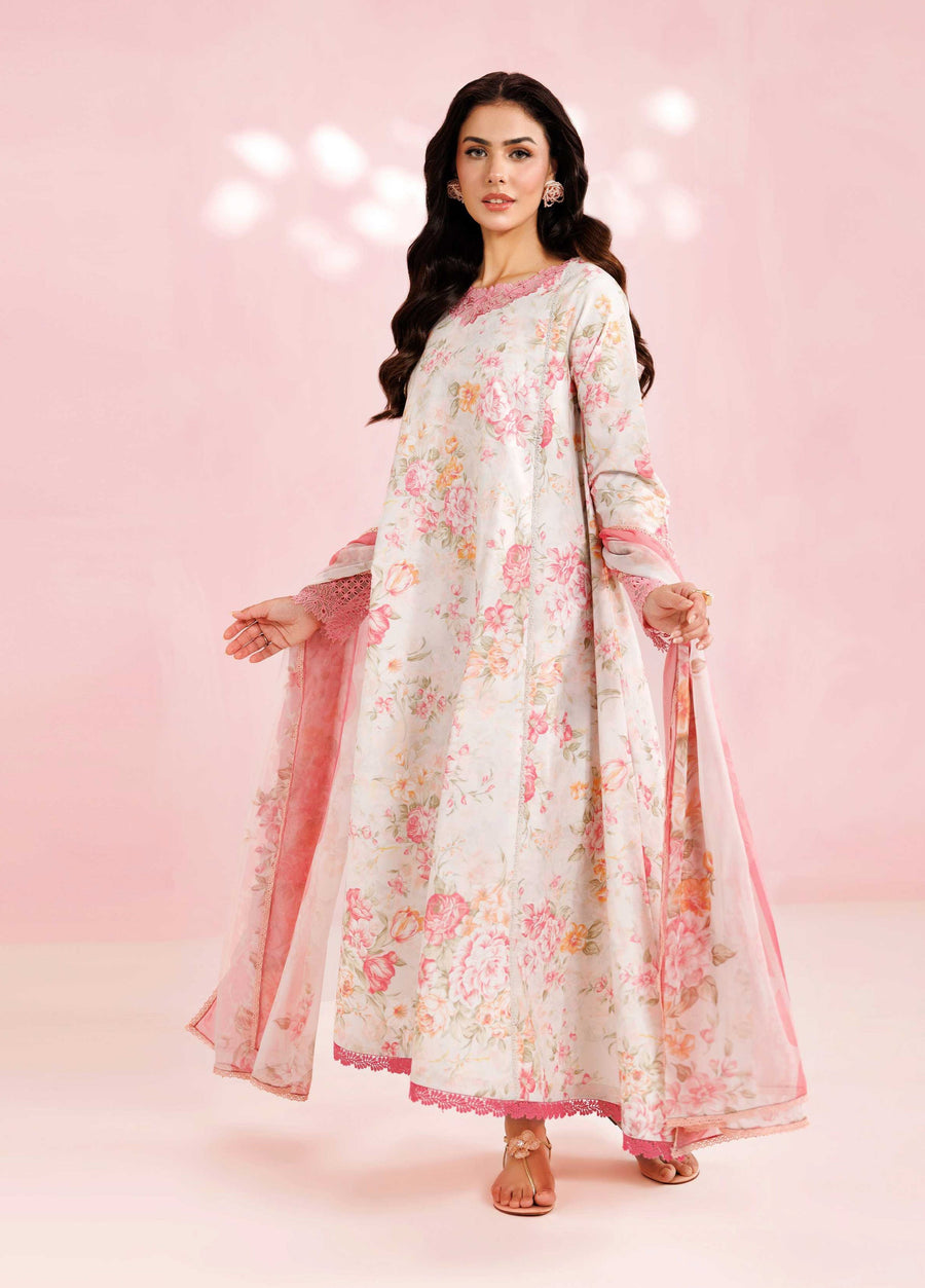 Woman wearing a cream floral printed unstitched lawn suit with pink embroidered neckline and hem, holding a matching pink floral dupatta