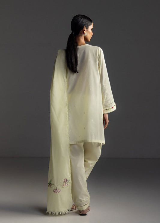 Back view of the vanilla embroidered lawn suit showcasing the plain back shirt, embroidered trousers cuffs, and detailed floral embroidered dupatta