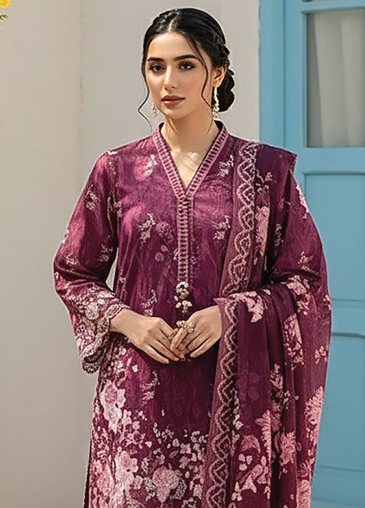 Close-up view of woman in deep plum floral printed lawn shirt with modest V-neck and intricate embroidery, holding matching dupatta
