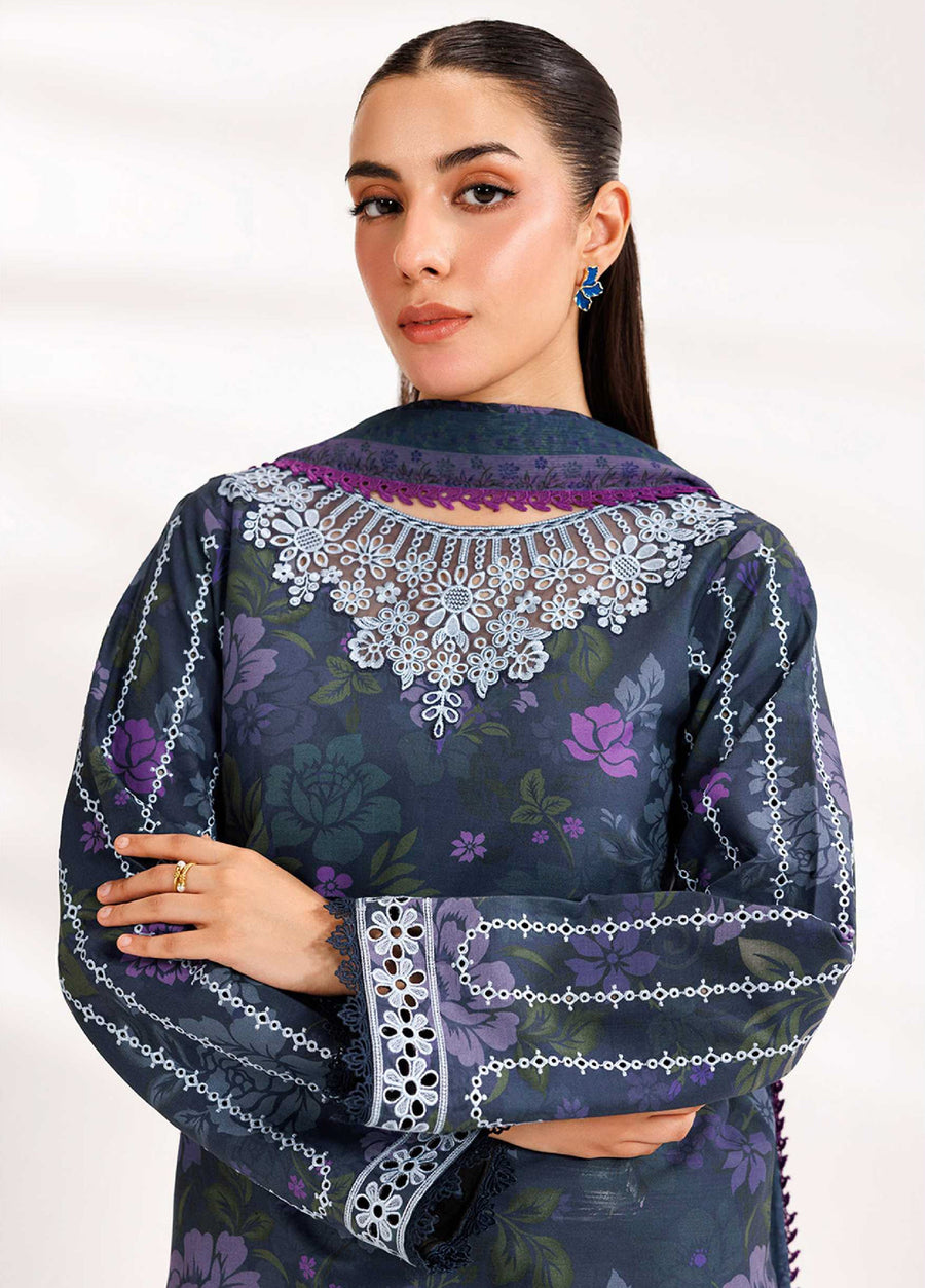 Close-up of the navy blue floral embroidered suit showing intricate white lace embroidery on the neckline and sleeves with fine floral prints.