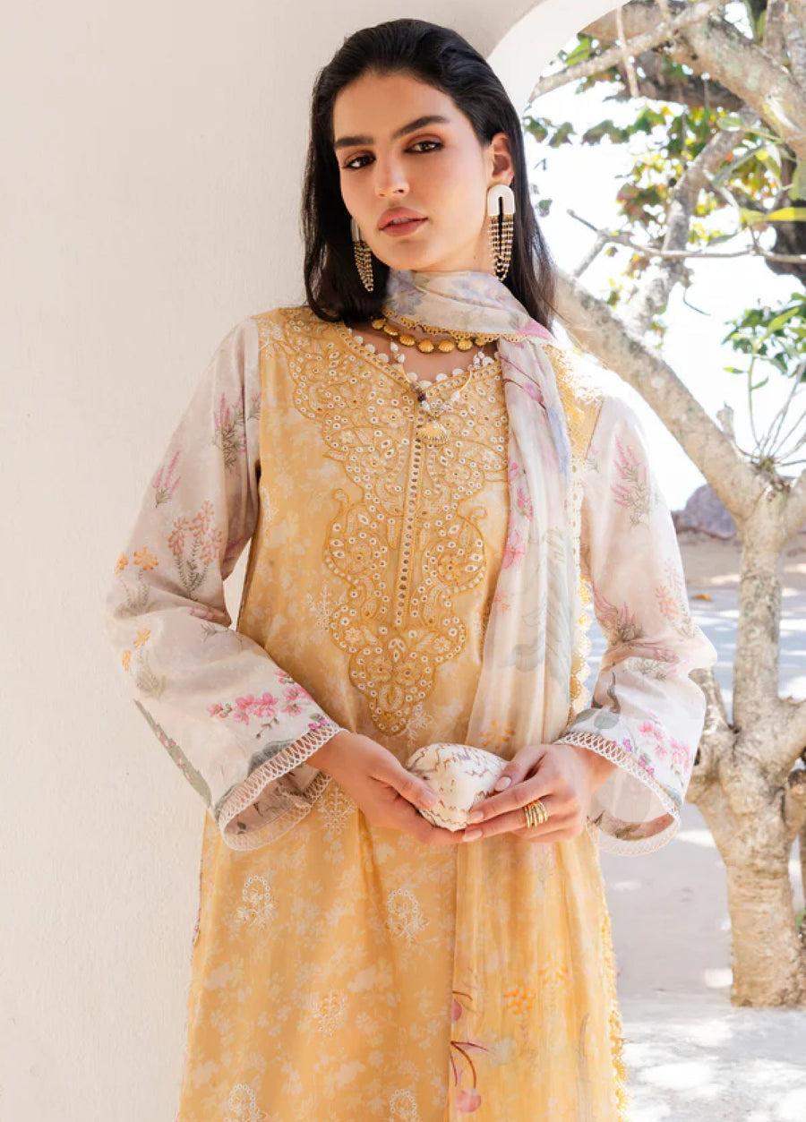 Close-up portrait of woman in yellow embroidered lawn kurta and printed chiffon dupatta posed outdoors under tree