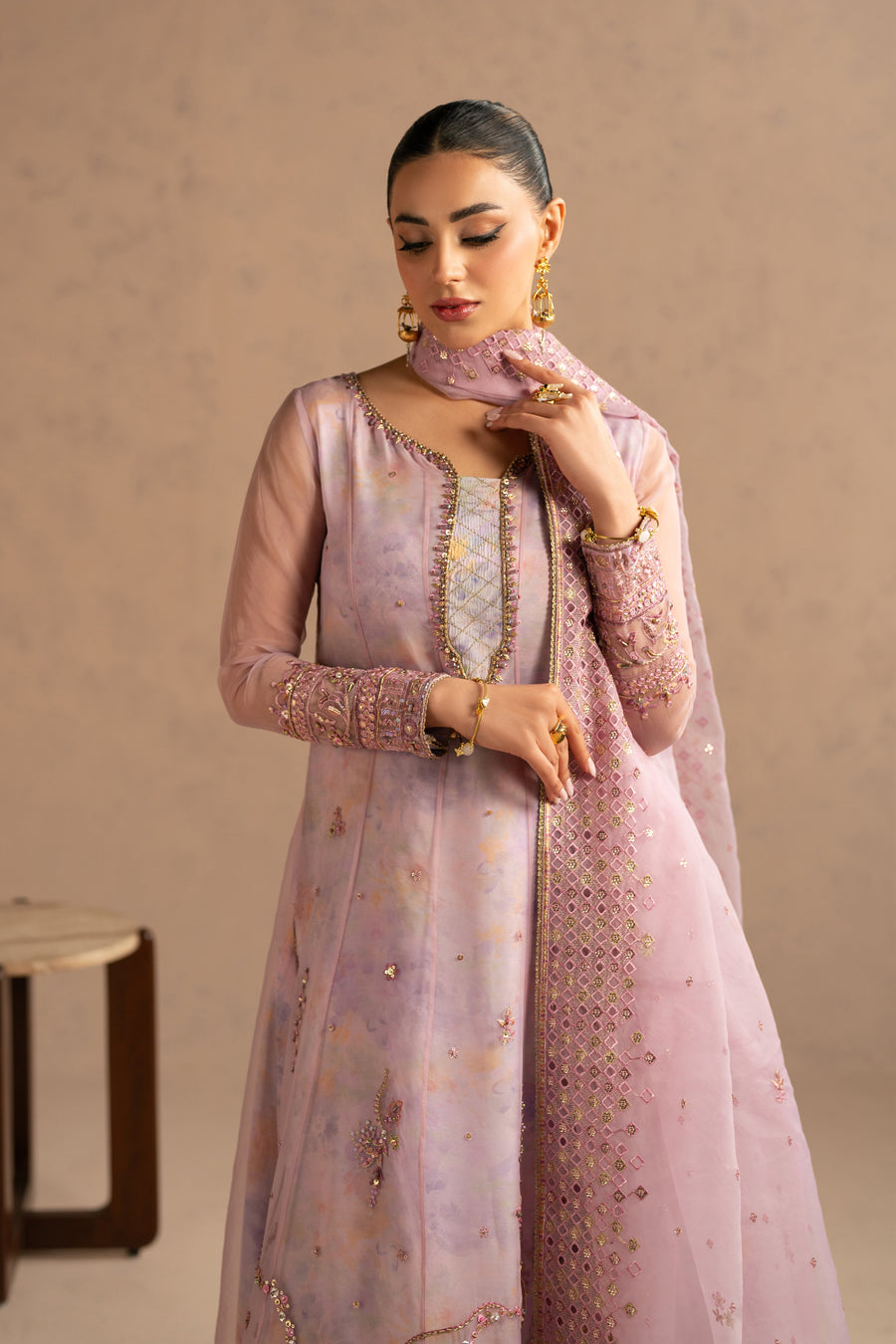 Elegant close-up showing neckline embroidery and dupatta draped over shoulder featuring intricate geometric embroidered border