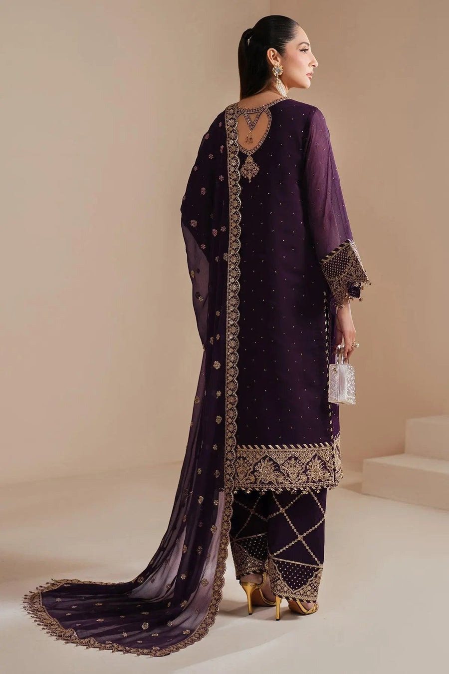 Back view of deep purple chiffon three-piece suit showing detailed embroidery and open keyhole design on back