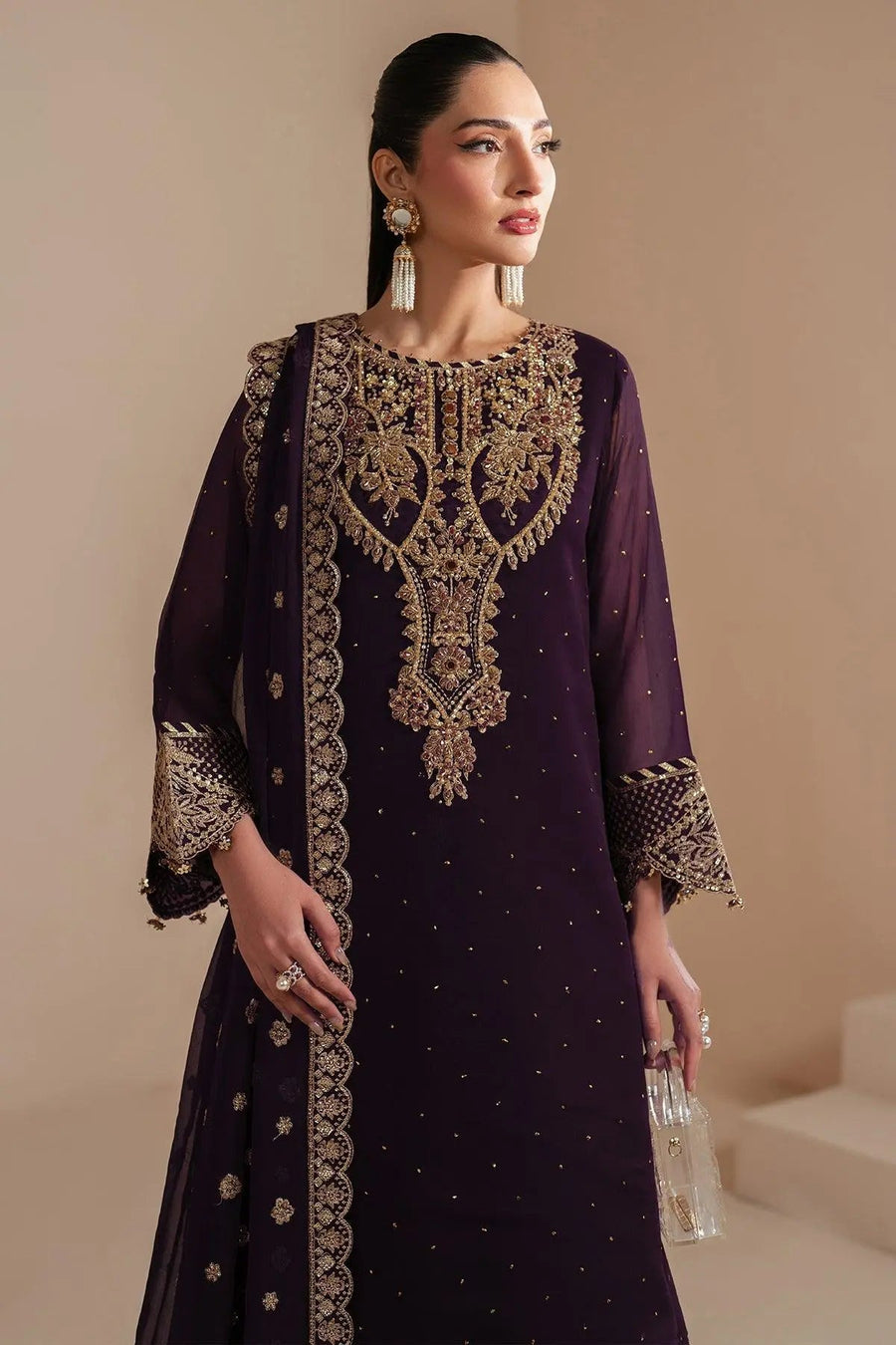 Close-up front view highlighting intricate gold embroidery and beadwork on neckline and sleeves of purple chiffon kameez