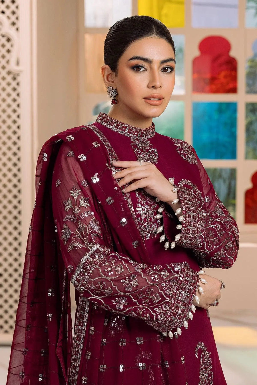 Side angle showing full outfit with embroidered shirt, trousers, and embellished dupatta drape