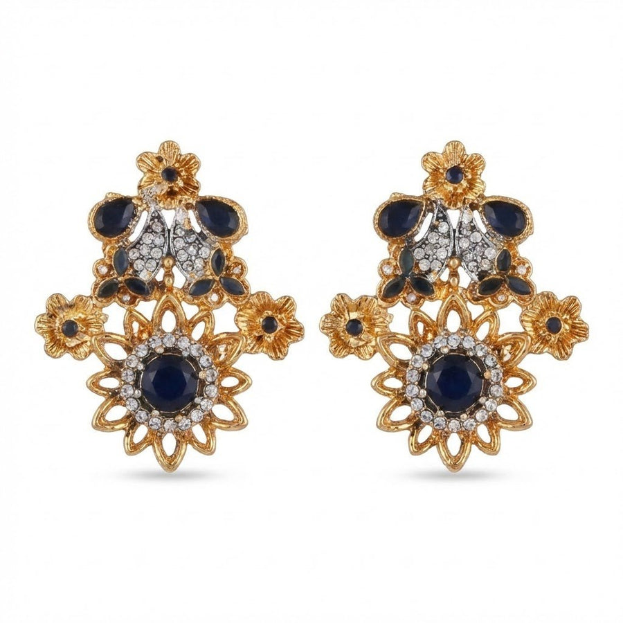 Pair of royal blue gemstone floral earrings with clear accents on white background showing gold-tone metal