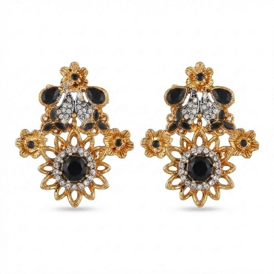 Pair of floral earrings with soft pink gemstones and white accent stones set in gold-tone metal on white background